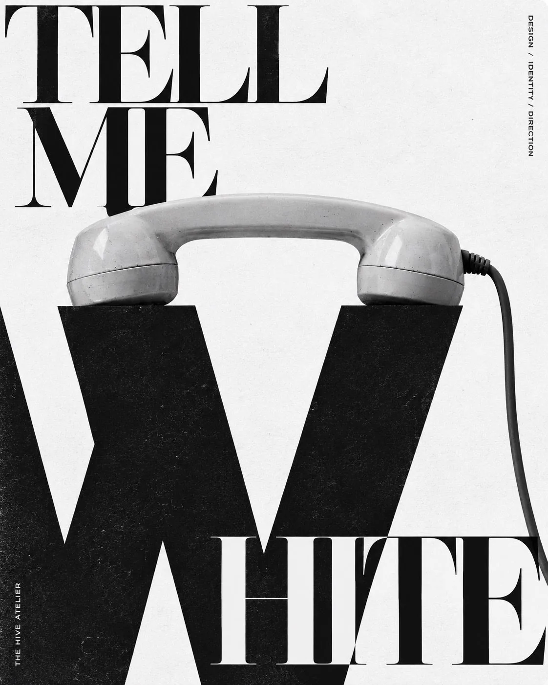 Poster: Tell me white. A white handset rests on a large black letter W.