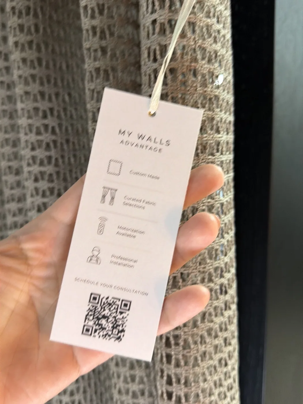 Hang tag: My Walls Advantage, with custom made, curated fabrics, motorization, professional installation and a QR code.